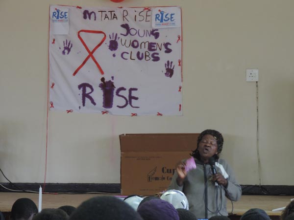 DoH rep doing condom education Rise Mthatha HIVAIDS event (2)