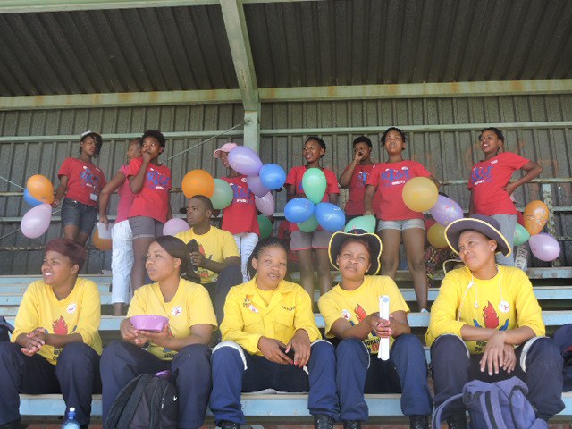 Cheering the members on the field