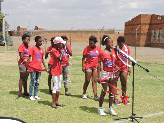 Rise club members presenting a poem and a song we are the future