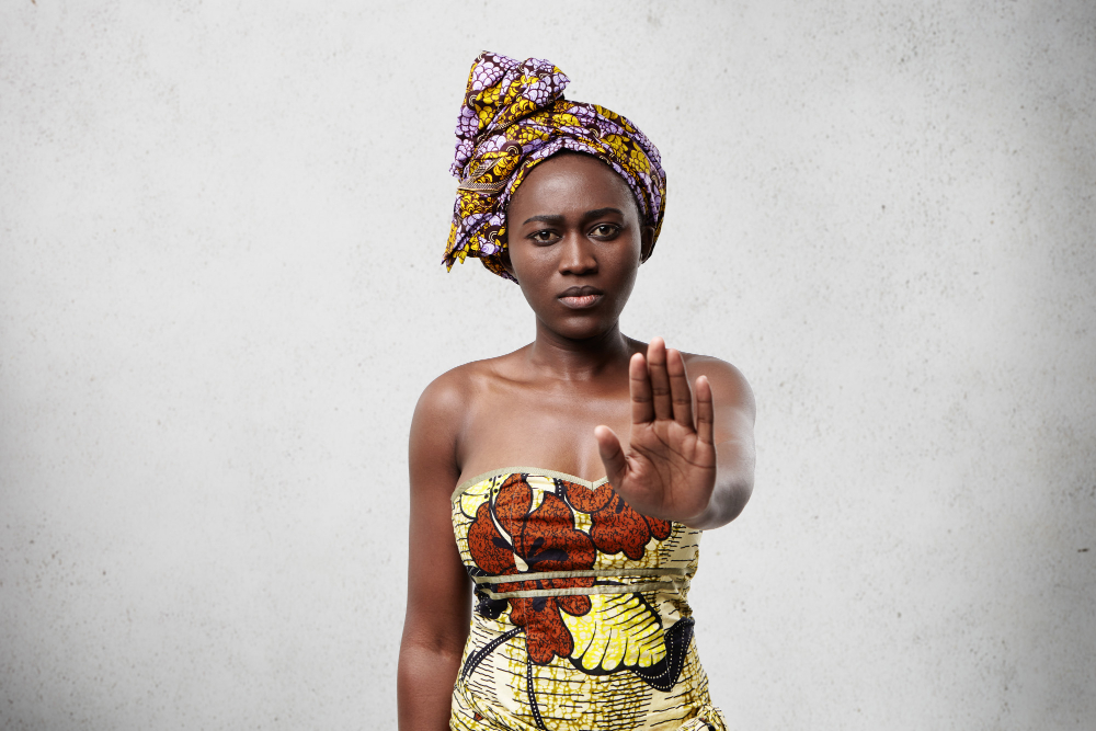stop-it-african-woman-with-dark-smooth-skin-wearing-traditional-clothes-showing-her-palm-denying-something-confident-dark-skinned-female-showing-no-gesture-veto-demand-concept.jpg